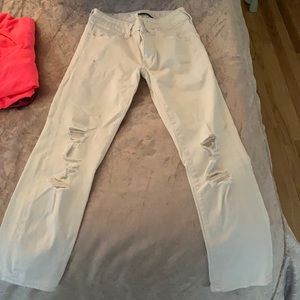 Super super stretch white ripped skinny jeans